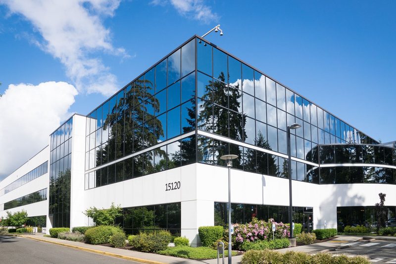 Modern glass-front commercial office building of the kind Patterson and Sons Construction builds and renovates